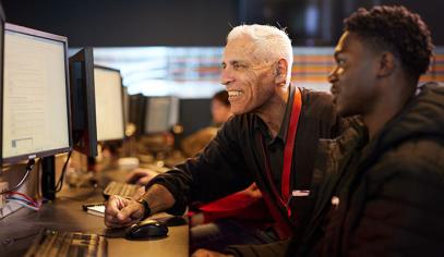 two people looking at a computer