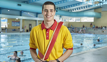 male with swimming equipment near a pool