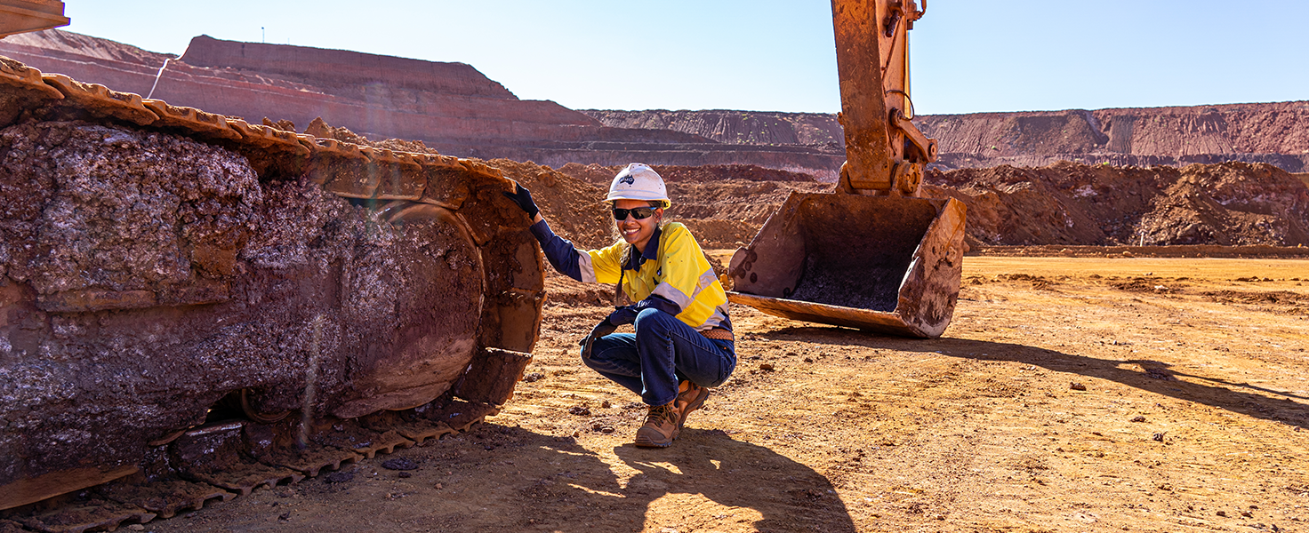 female with protective outfit working at a mine site