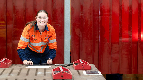 woman in protective outfit with tools
