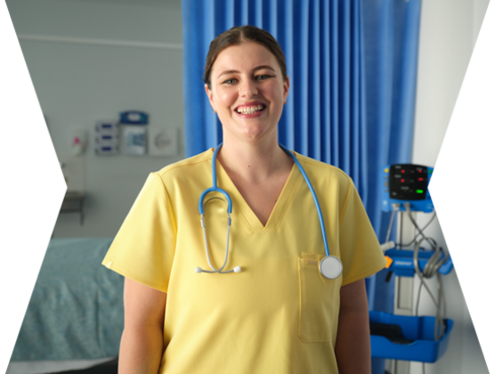 female nurse smiling in a hospital ward setting